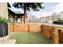 Fully fenced yard featuring a well-maintained lawn, offering privacy and a safe space for outdoor enjoyment at 2909 Newton St, Denver, CO 80211