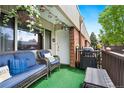Inviting patio featuring wicker furniture, a grill, and serene outdoor ambiance at 3663 S Sheridan Blvd # O15, Denver, CO 80235
