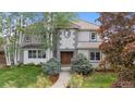 Charming home facade with manicured landscaping, a tile roof, and a welcoming entryway at 172 S Forest St, Denver, CO 80246