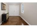 Inviting foyer with gleaming hardwood floors, a stylish console table, and a bright window at 172 S Forest St, Denver, CO 80246