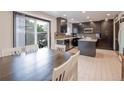 Modern kitchen with dark cabinets and stainless steel appliances at 12644 W Virginia Ave, Lakewood, CO 80228