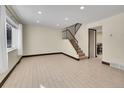 Spacious living room featuring hardwood floors and a view of the staircase at 12644 W Virginia Ave, Lakewood, CO 80228