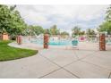 Community swimming pool with brick fence at 12644 W Virginia Ave, Lakewood, CO 80228