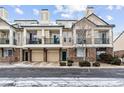 Charming townhome with a brick facade, balconies, and attached garages at 1861 Mallard Dr, Superior, CO 80027