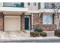 Inviting townhome facade with brick accents, a single car garage, and a welcoming front door at 1861 Mallard Dr, Superior, CO 80027