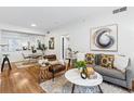 Comfortable living room featuring modern décor, hardwood floors, and plenty of natural light at 1861 Mallard Dr, Superior, CO 80027