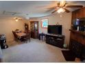 Spacious living room including a fireplace, stained glass window, and room for a large dining set at 8338 Charles Way, Denver, CO 80221