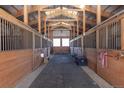 Well-maintained horse stalls with wood construction and open ceilings for excellent ventilation at 300 Gold Hill Rd, Breckenridge, CO 80424