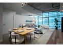 Bright living room featuring floor-to-ceiling windows, city views, and modern decor at 1700 Bassett St # 1119, Denver, CO 80202