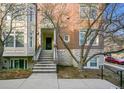 Brick front exterior with stairs leading to the entrance at 45 Jackson St # A, Denver, CO 80206