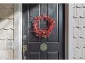 Dark-colored front door adorned with a red berry wreath at 45 Jackson St # A, Denver, CO 80206