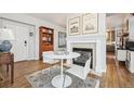 Open living room with a fireplace and built-in shelving at 45 Jackson St # A, Denver, CO 80206