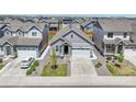 Aerial view of a lovely gray home with a two-car garage in a vibrant neighborhood at 27853 E 8Th Ave, Aurora, CO 80018