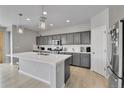 Modern kitchen with stainless appliances, white countertops and gray cabinets at 27853 E 8Th Ave, Aurora, CO 80018