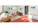 Bright living room features a decorative rug, modern furniture, and warm lighting at 1125 Newark St, Aurora, CO 80010
