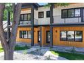 Stylish two-story duplex showcasing modern architecture and manicured landscaping at 2405 S Franklin, Denver, CO 80210