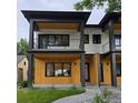 Contemporary home with clean lines, featuring a mix of wood and white siding, and minimalist landscaping at 2405 S Franklin, Denver, CO 80210