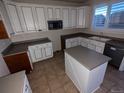 Spacious kitchen featuring an island and white cabinets at 17 Ellendale St, Castle Rock, CO 80104