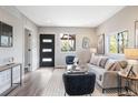 Bright and inviting living room area with modern black door and gray and black decor at 15 Hazel Ct, Denver, CO 80219