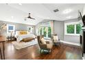 Spacious main bedroom with a vaulted ceiling, a ceiling fan, and a private balcony at 325 S High St, Denver, CO 80209