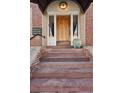 Close-up of the building's entrance, highlighting the intricate brickwork and charming details at 2210 E Mississippi Ave # 3, Denver, CO 80210