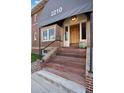 Inviting entryway with a classic wooden door and elegant awning at 2210 E Mississippi Ave # 3, Denver, CO 80210