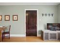 Cozy living room featuring hardwood floors, neutral walls, and ample natural light at 2210 E Mississippi Ave # 3, Denver, CO 80210