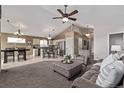 Comfortable living space with plush seating, seamlessly connecting the kitchen and dining areas at 14713 Josephine St, Thornton, CO 80602