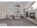 Relaxing living room with a fireplace, built-in shelves and comfortable furnishings at 14713 Josephine St, Thornton, CO 80602