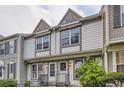 Attractive townhome exterior with detailed trim and a tidy front yard at 1811 S Quebec Way # 31, Denver, CO 80231