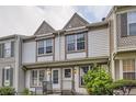 Charming two-story townhome exterior with decorative trim and well-maintained landscaping at 1811 S Quebec Way # 31, Denver, CO 80231