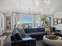 Bright and spacious living room with a large sectional couch and incredible views at 6405 Warriors Run, Littleton, CO 80125