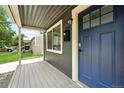 Inviting front porch with blue door and the house number prominently displayed at 1941 Alton St, Aurora, CO 80010
