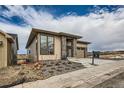 Attractive single-Gathering home with modern architectural elements and low-maintenance landscaping at 454 Basin Daisy St, Castle Rock, CO 80104