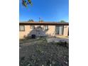 Home's backyard, showing a large grassy area and a shed at 16786 E Kent Dr, Aurora, CO 80013