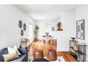 Bright dining area with hardwood floors and a modern dining set at 2739 S Sherman St, Englewood, CO 80113