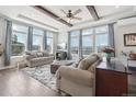 Spacious living room with mountain views and hardwood floors at 1729 Santa Fe Mountain Rd, Evergreen, CO 80439