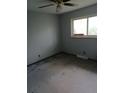 Bedroom with ceiling fan, window, and neutral carpet, offering a blank canvas for personalization at 6027 W 61St Pl, Arvada, CO 80003