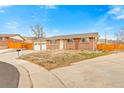 Charming brick ranch with a two-car garage on a corner lot at 7162 Quay St, Arvada, CO 80003