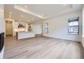 Bright open-concept living room, seamlessly connected to a modern kitchen at 15616 W Beloit Ave, Morrison, CO 80465