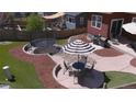 Enjoy a serene backyard with a dining patio, BBQ, and a trampoline surrounded by manicured landscaping at 4840 Point Mesa St, Castle Rock, CO 80108