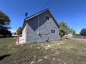 Home exterior featuring a clean design and an outdoor gas meter, a blend of functionality and style at 660 Hickory St, Hudson, CO 80642
