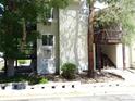View of a two story condo building exterior, showing balconies and trimmed with light siding at 17331 E Mansfield Ave # 311L, Aurora, CO 80013