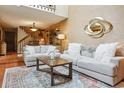 Bright living room featuring soaring ceilings, tile floors, plush furniture and decorator touches for a warm and inviting space at 2783 W Long Dr # B, Littleton, CO 80120