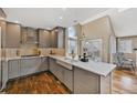 Charming kitchen with updated appliances, custom cabinets, and a farmhouse sink at 9443 Palisade Ct, Highlands Ranch, CO 80130