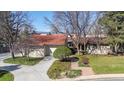 Inviting exterior showcasing a well-maintained lawn and a convenient two-car garage at 4749 Old Post Ct, Boulder, CO 80301