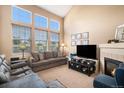 Vaulted ceilings and large windows fill this living room with natural light at 23235 York Ave, Parker, CO 80138
