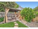 Cozy backyard patio with a gazebo and comfortable seating, perfect for relaxing at 10223 W 77Th Dr, Arvada, CO 80005