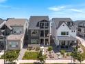 Beautiful three-story home with modern architecture, balconies, landscaping, and stunning curb appeal at 16722 Shoshone St, Broomfield, CO 80023