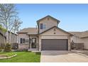 Charming two-story home with a two car garage, a well-manicured lawn, and mature trees at 4620 E 135Th Way, Thornton, CO 80241